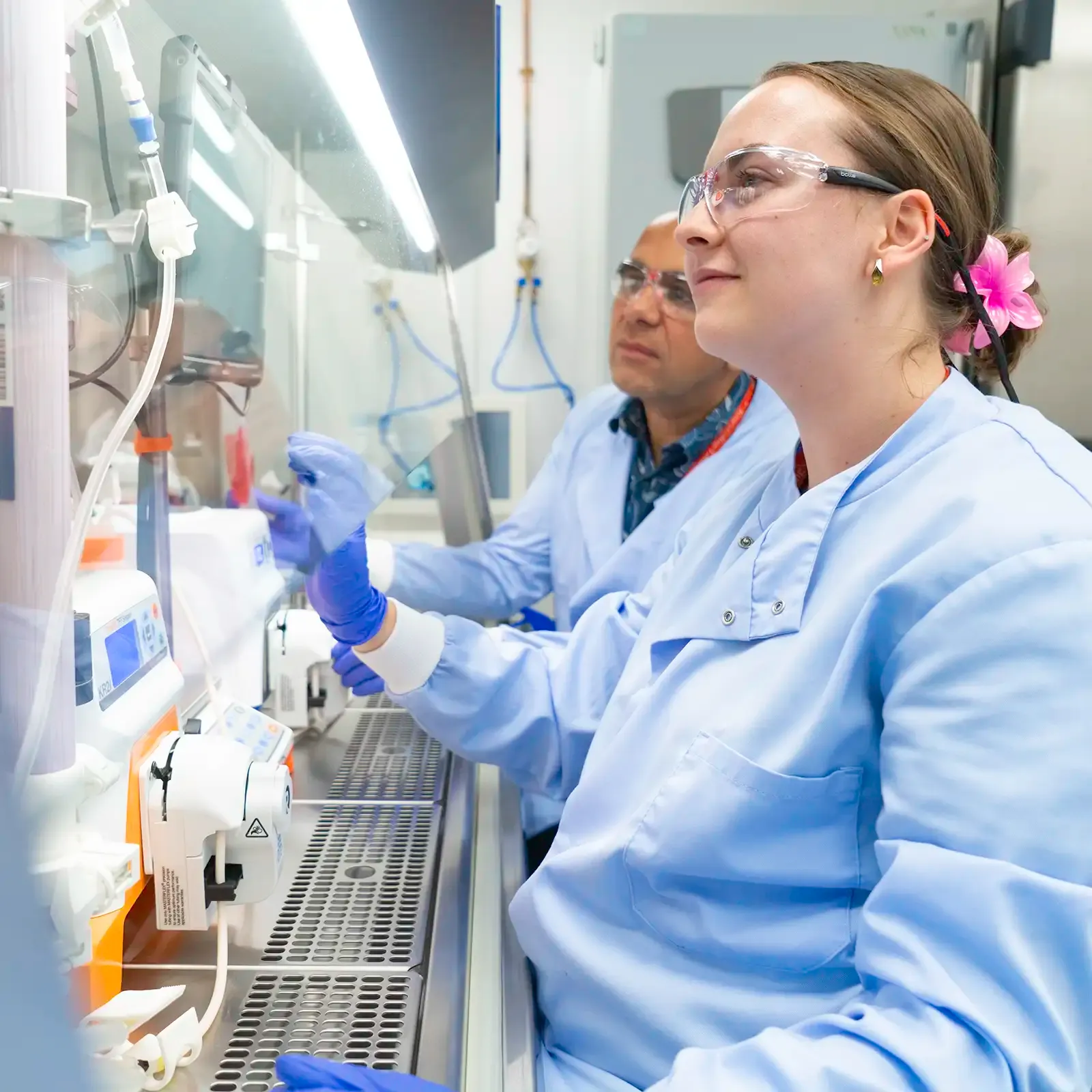 MSAT Laboratory Scientists observing results on monitor