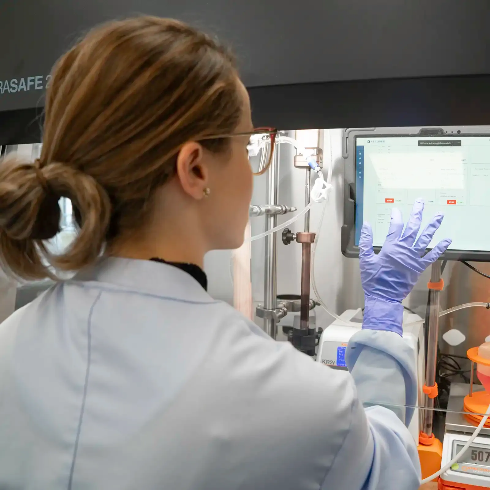 Scientist working with touchscreen