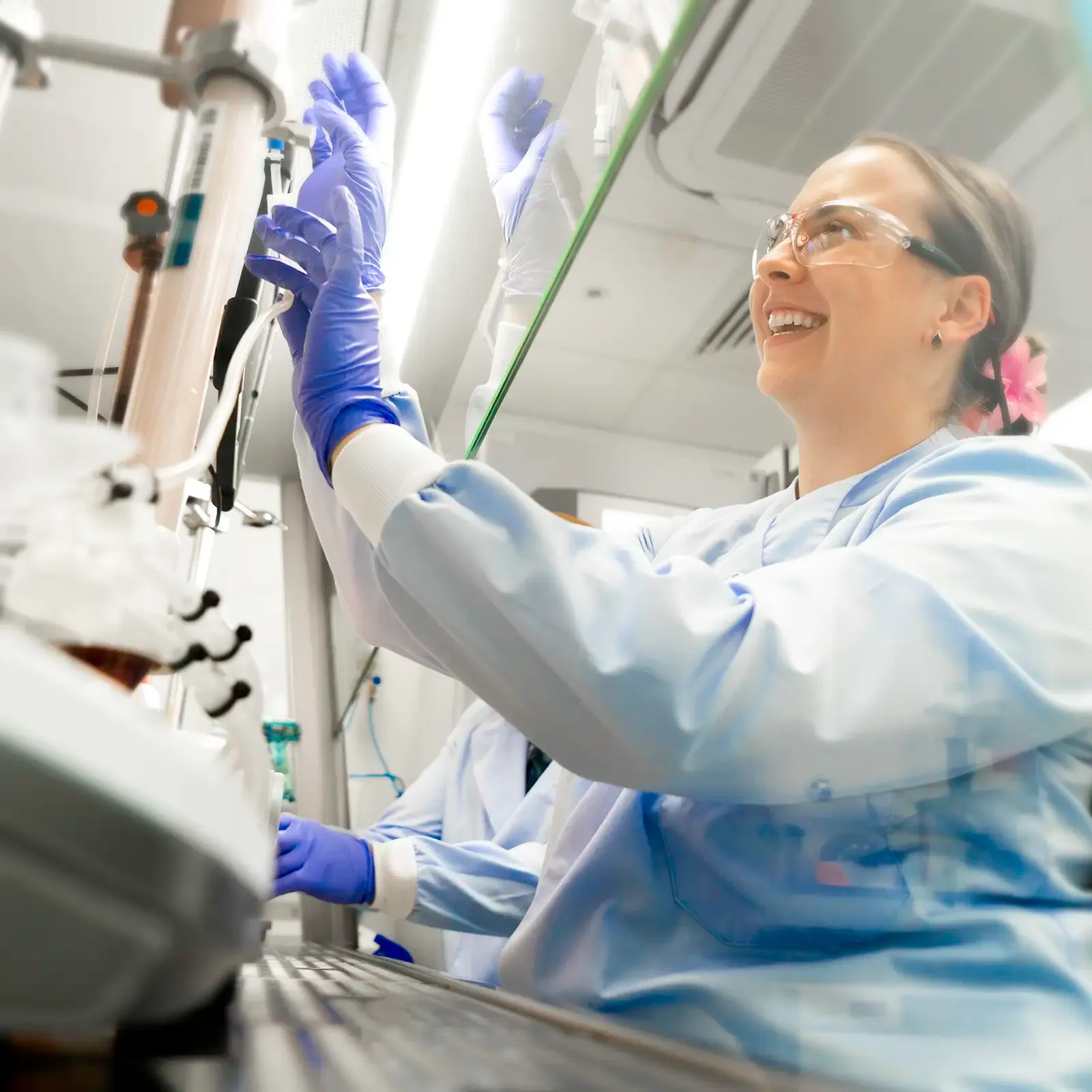 Smiling GMP scientist at work in production laboratory