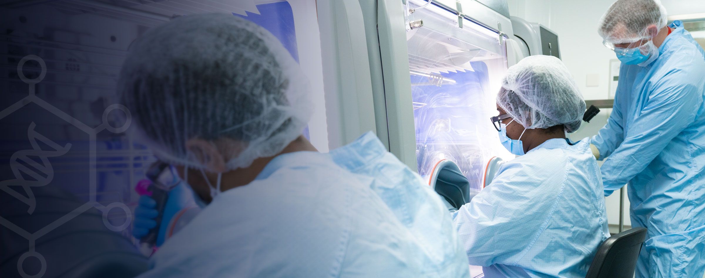 GTVF scientists working in a cleanroom laboratory producing retroviral vectors