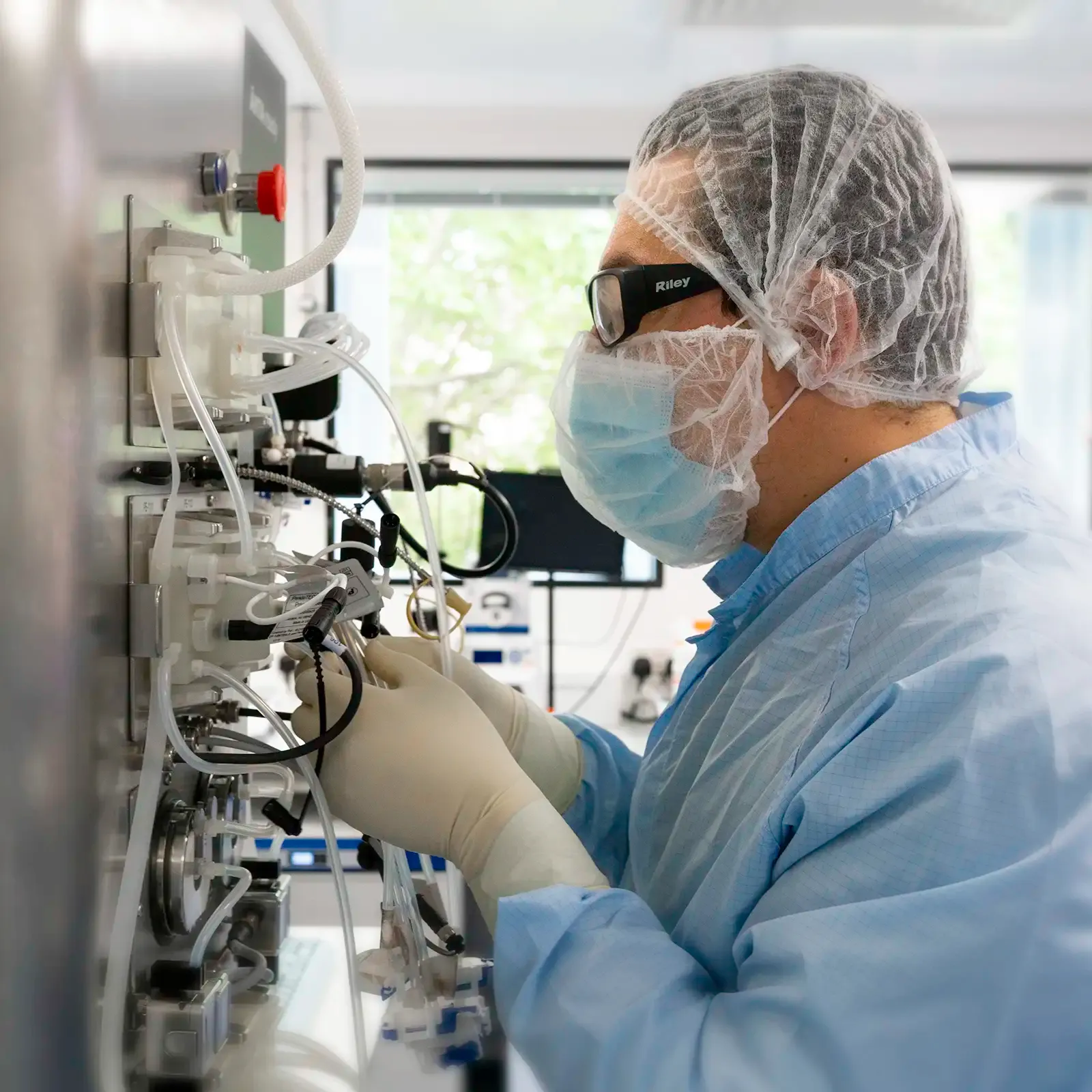 Laboratory scientist preparing retroviral production machine